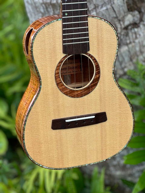 Curly koa tenor with a spruce top and shell binding