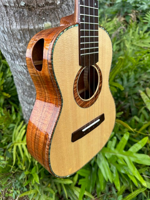 Curly koa tenor with a spruce top and shell binding