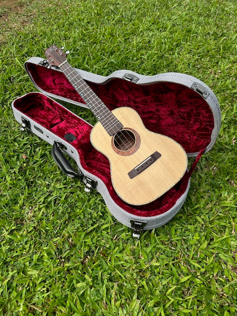 Curly koa tenor with a spruce top and shell binding